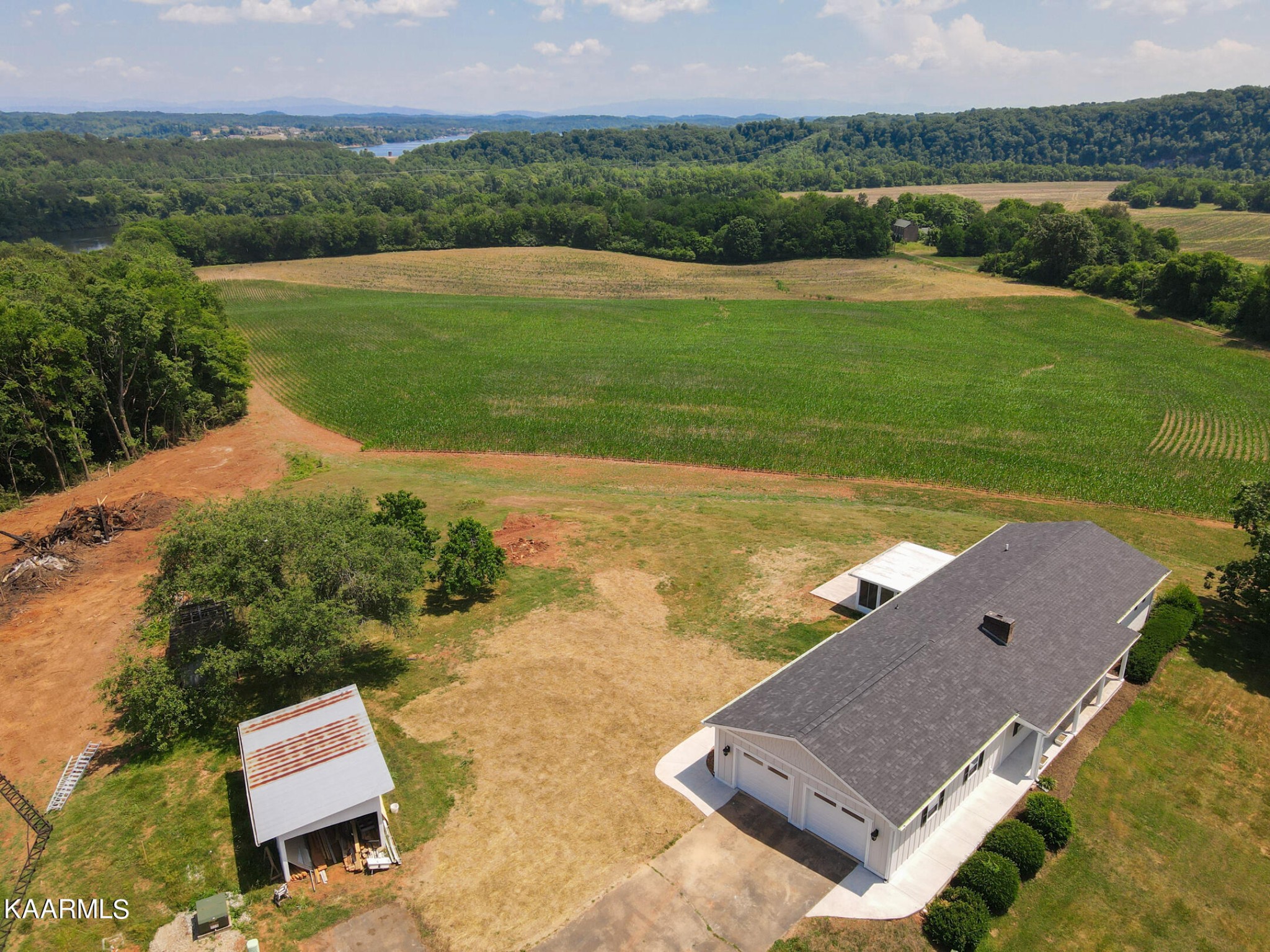 3877 Riverview Road Lenoir City, TN 37771 - Photo 43 of 47 an aerial view of a house with a garden and lake view
