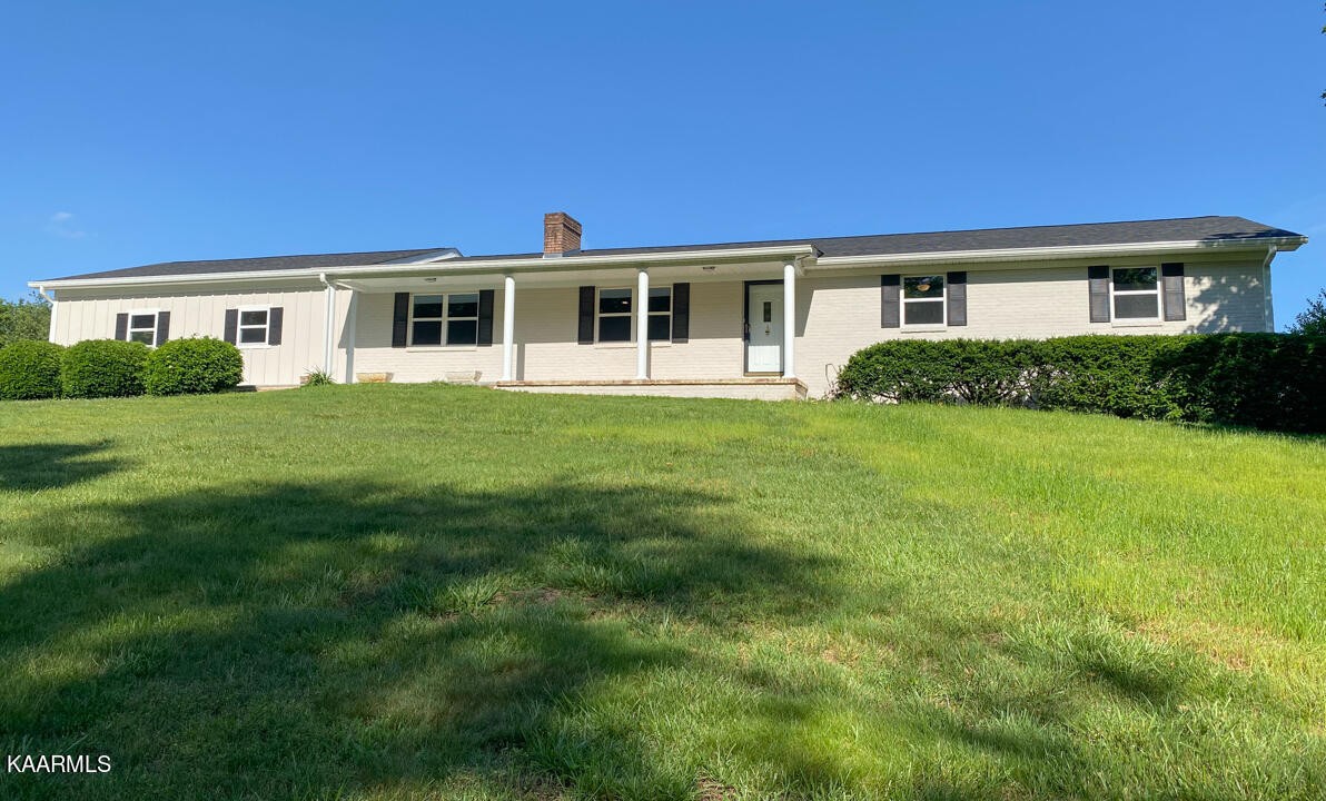 3877 Riverview Road Lenoir City, TN 37771 - Photo 44 of 47 a front view of a house with a yard