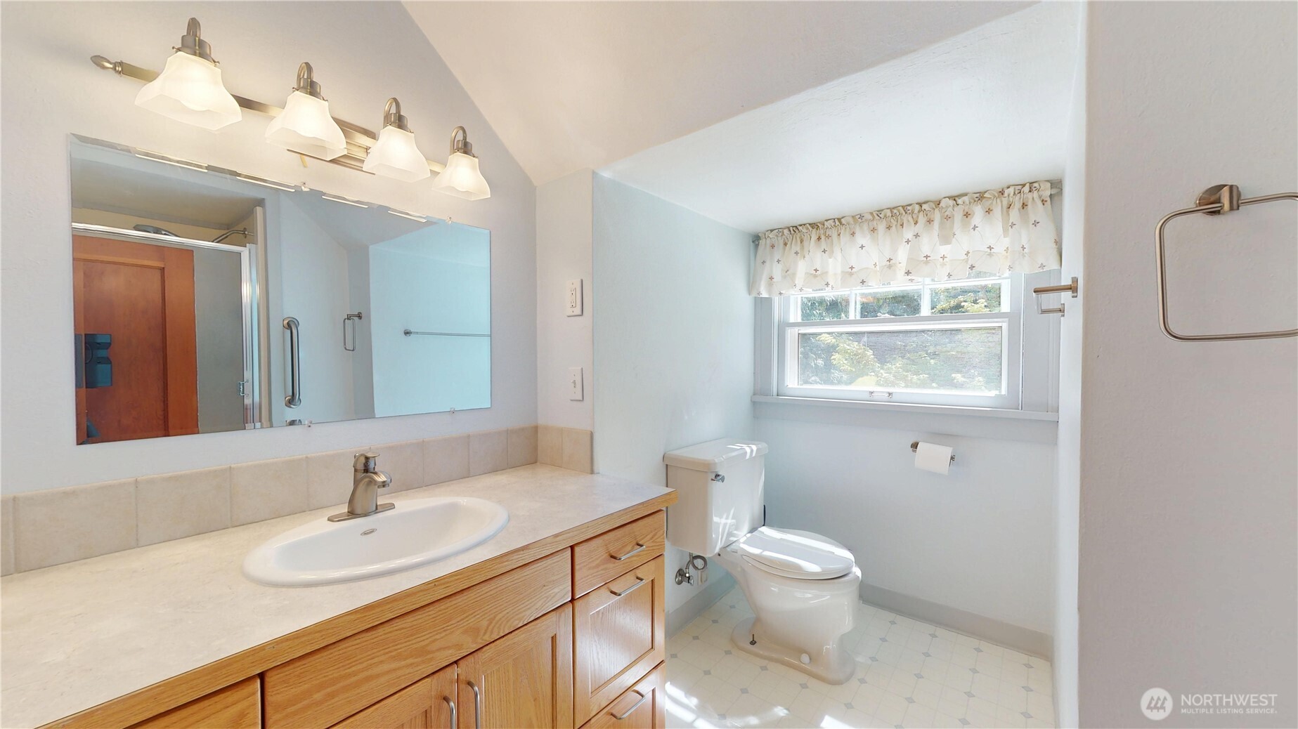 1533 Northeast Tagholm Road Poulsbo, WA 98370 - Photo 19 of 40 a bathroom with a toilet sink and mirror