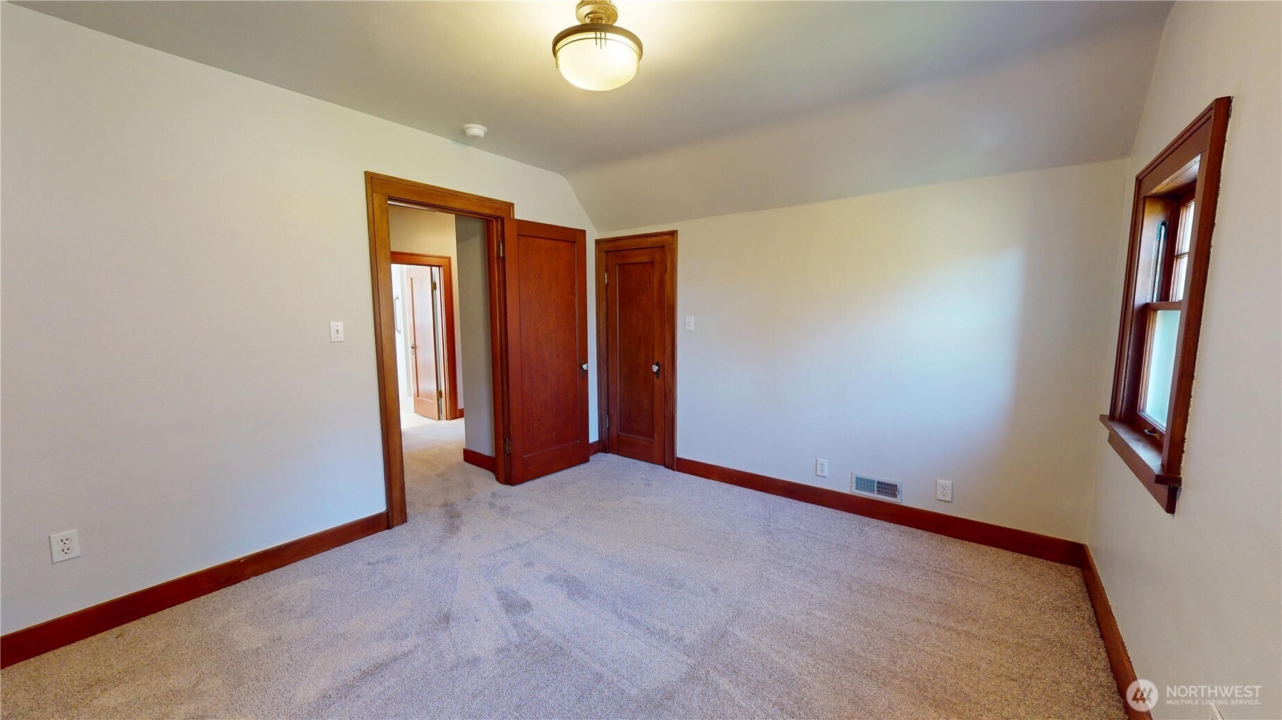 1533 Northeast Tagholm Road Poulsbo, WA 98370 - Photo 23 of 40 an empty room with closet and mirror
