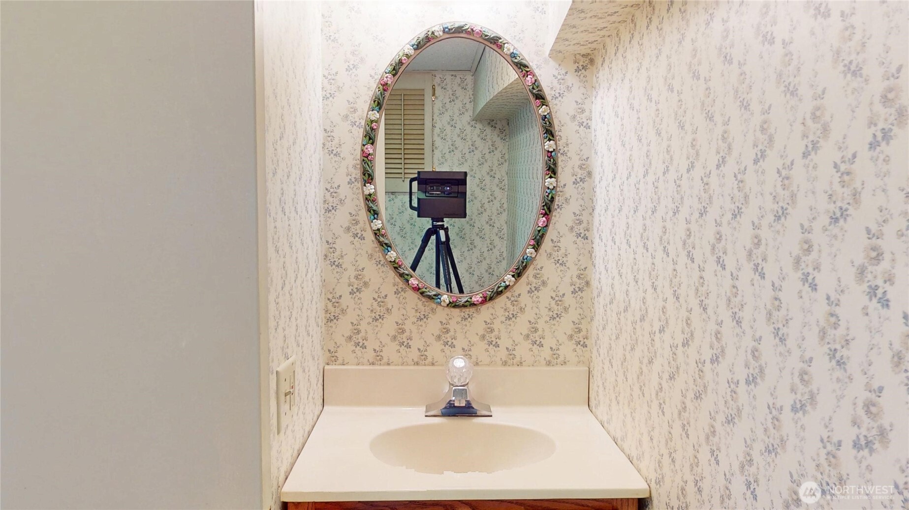 1533 Northeast Tagholm Road Poulsbo, WA 98370 - Photo 25 of 40 a bathroom with a sink and mirror