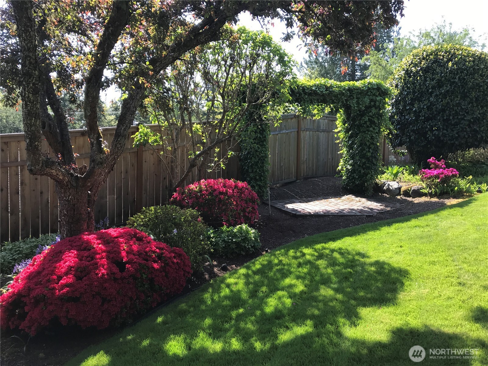 1533 Northeast Tagholm Road Poulsbo, WA 98370 - Photo 36 of 40 a backyard of a house with yard and outdoor seating