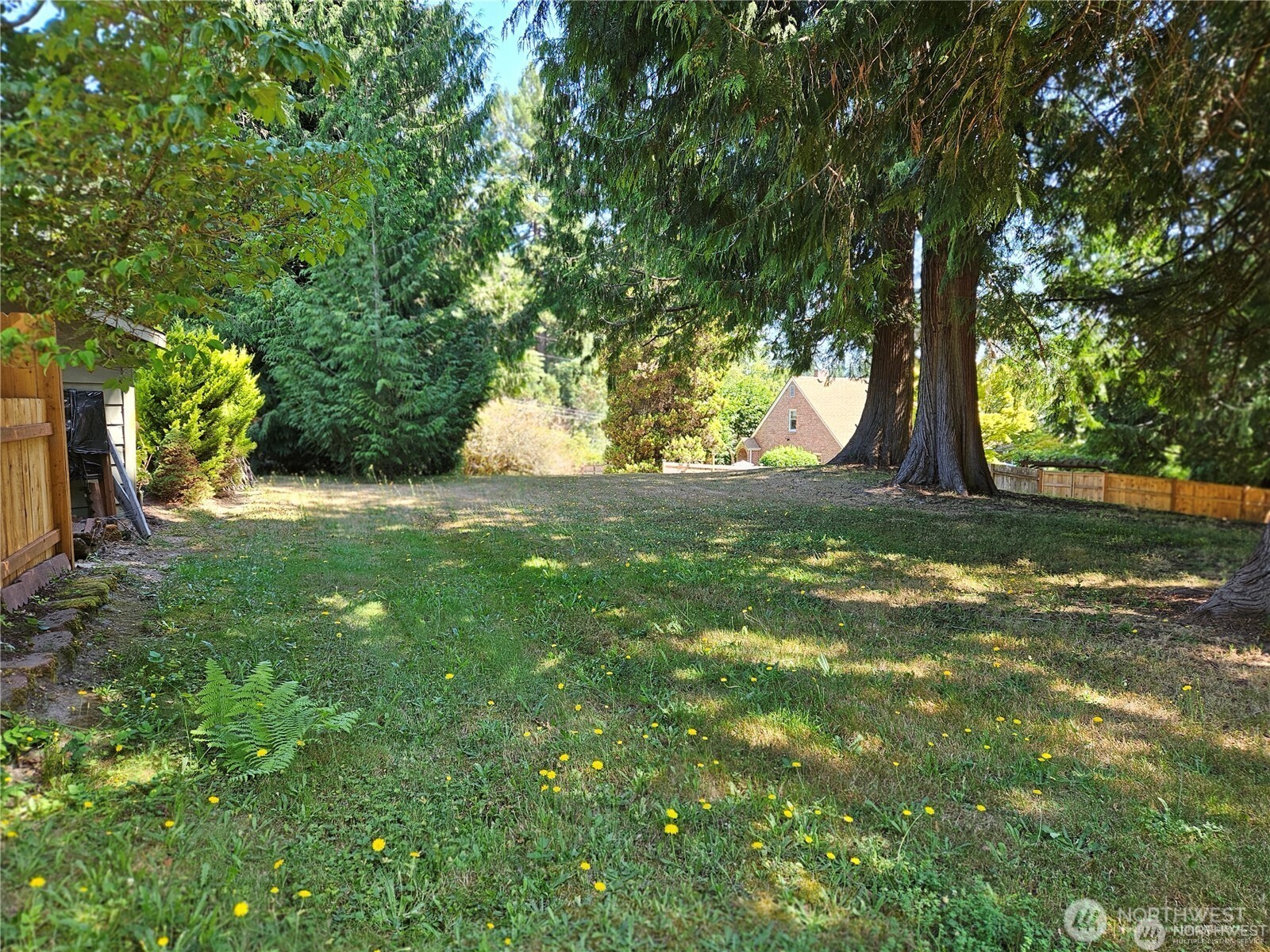 1533 Northeast Tagholm Road Poulsbo, WA 98370 - Photo 38 of 40 a view of a yard with a tree