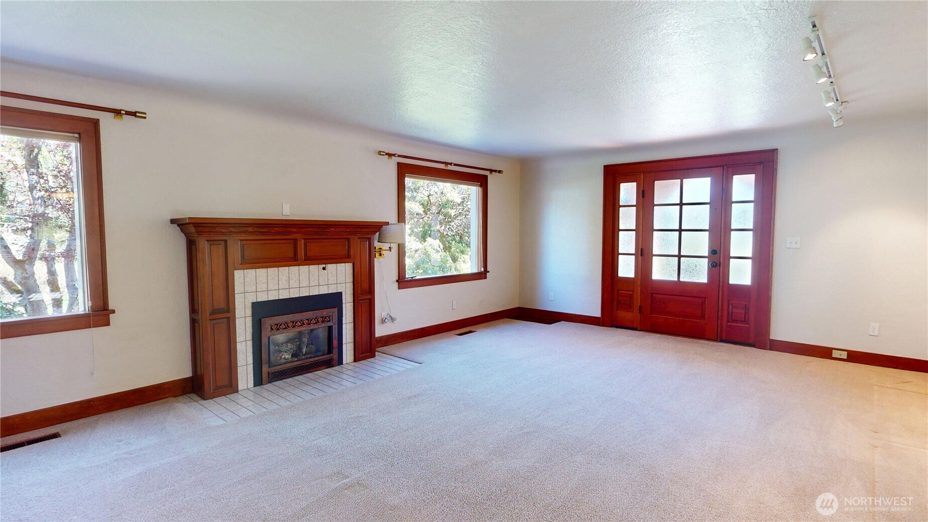 1533 Northeast Tagholm Road Poulsbo, WA 98370 - Photo 6 of 40 an empty room with windows