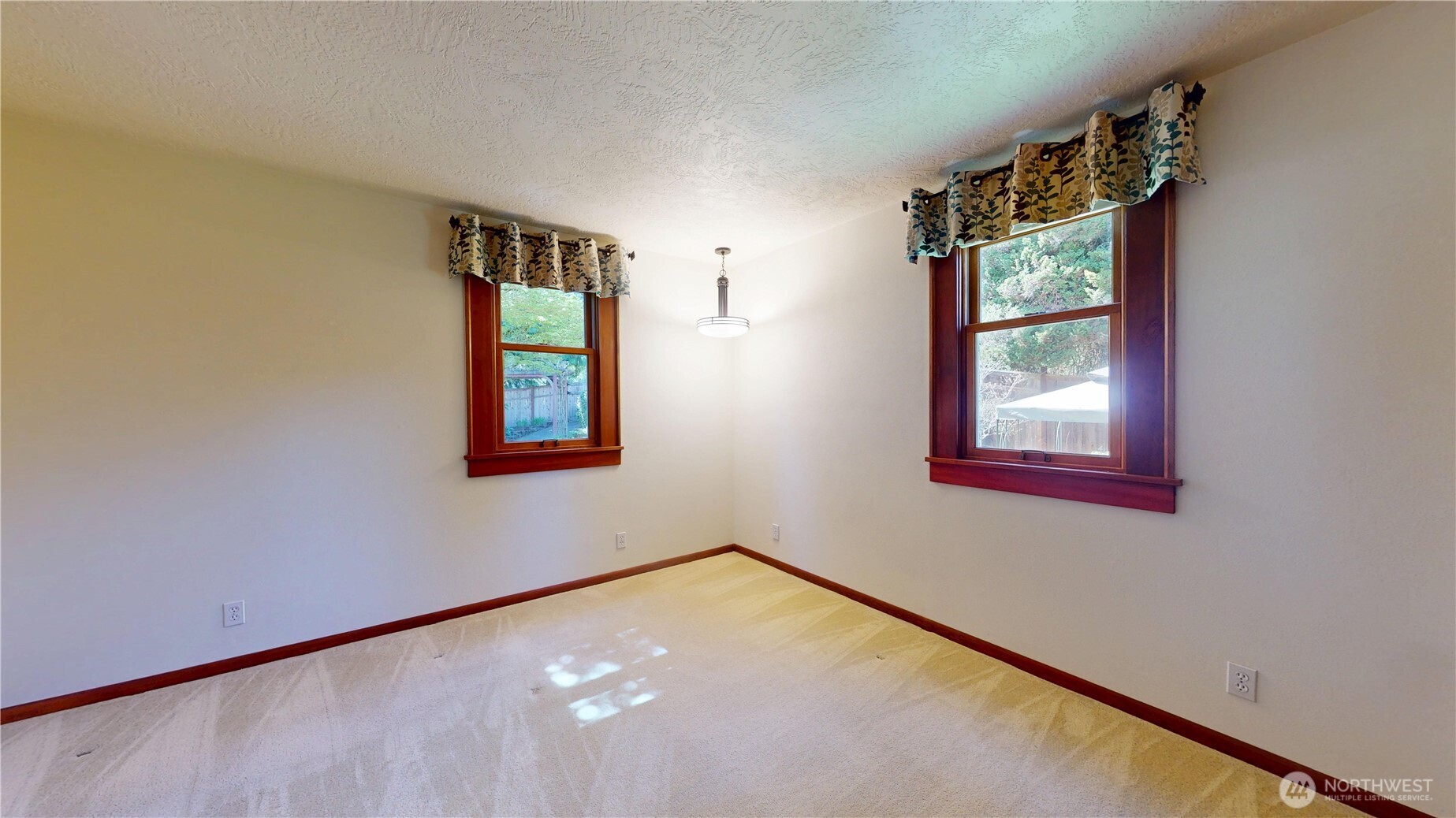 1533 Northeast Tagholm Road Poulsbo, WA 98370 - Photo 9 of 40 an empty room with windows