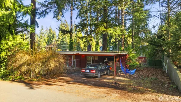 a view of a car park in front of a house