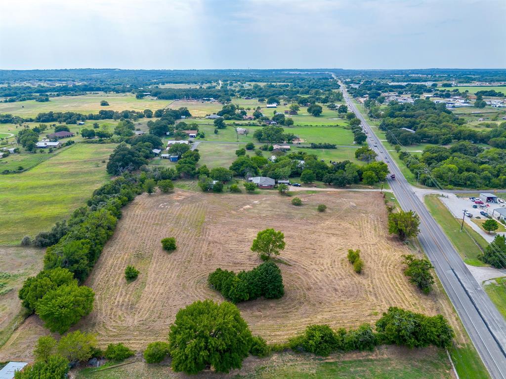 2151 West Highway 199 Springtown, TX 76082 - Photo 6 of 16 an aerial view of a city with lots of residential buildings ocean and mountain view in back