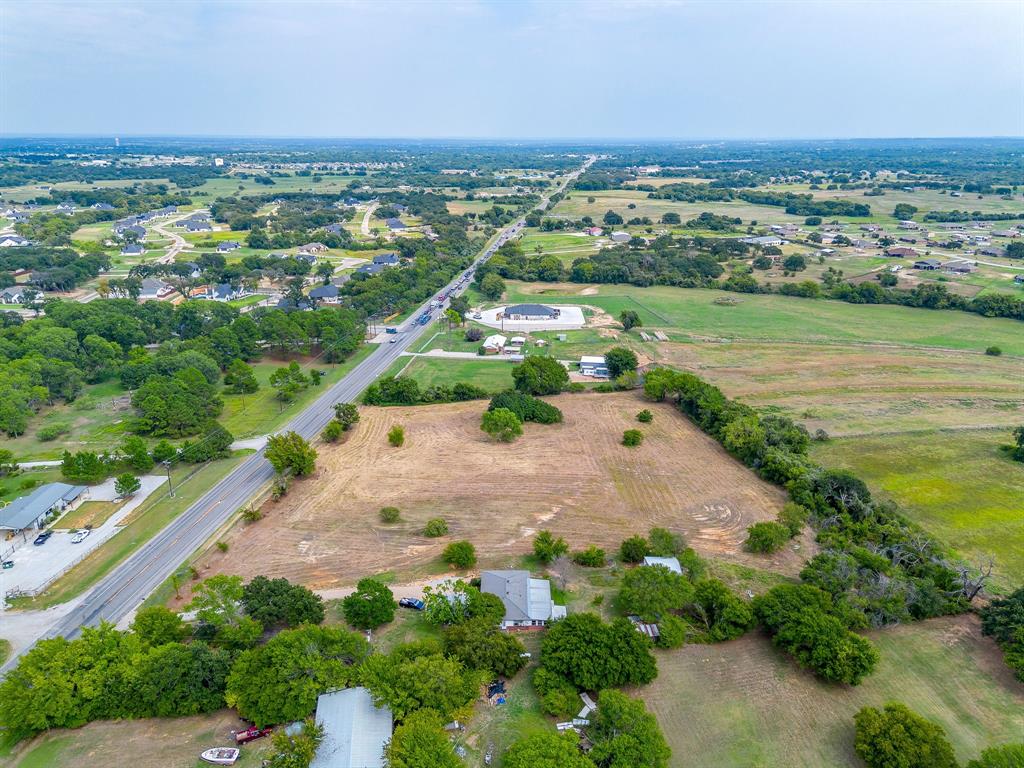 2151 West Highway 199 Springtown, TX 76082 - Photo 10 of 16 an aerial view of a city with lots of residential buildings and mountain view in back