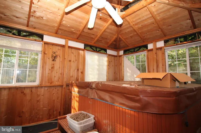 a room with furniture and next to a window