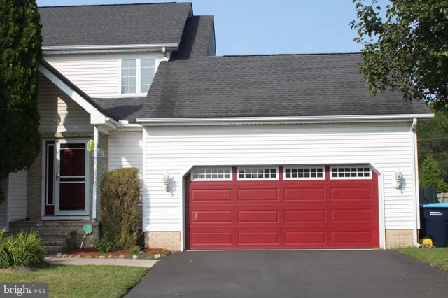 a front view of a house with a garage