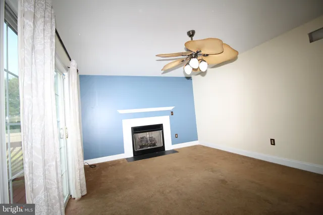 a white toilet sitting next to a white sink