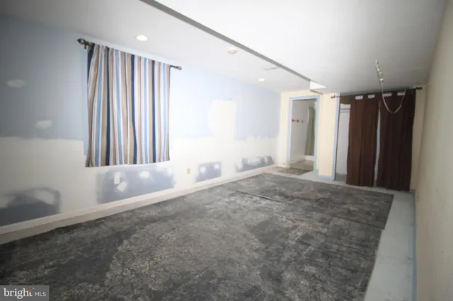 a bathroom with a shower a toilet and a shower