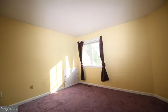 a view of a room with a window