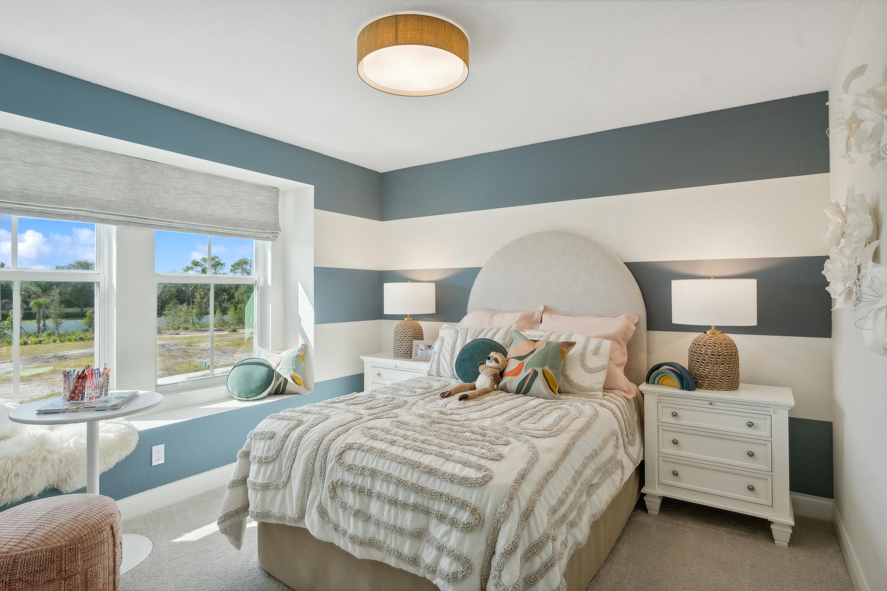 181 Southeast Birch Terrace, Unit 735 Stuart, FL 34997 - Photo 35 of 44 a bed room with a bed and a large window