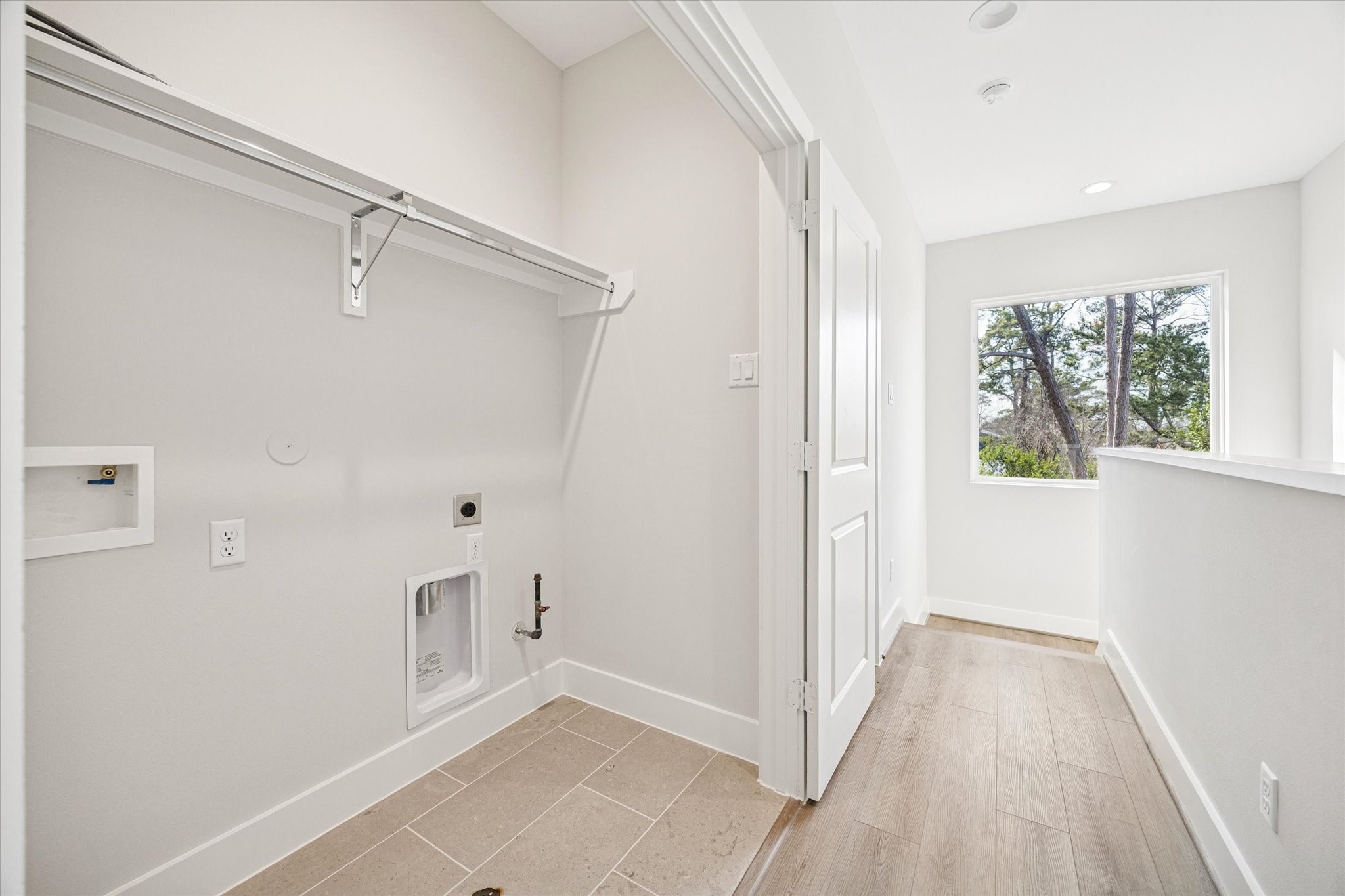 520 Janisch Road Houston, TX 77018 - Photo 19 of 28 a view of an empty room with wooden floor and a window