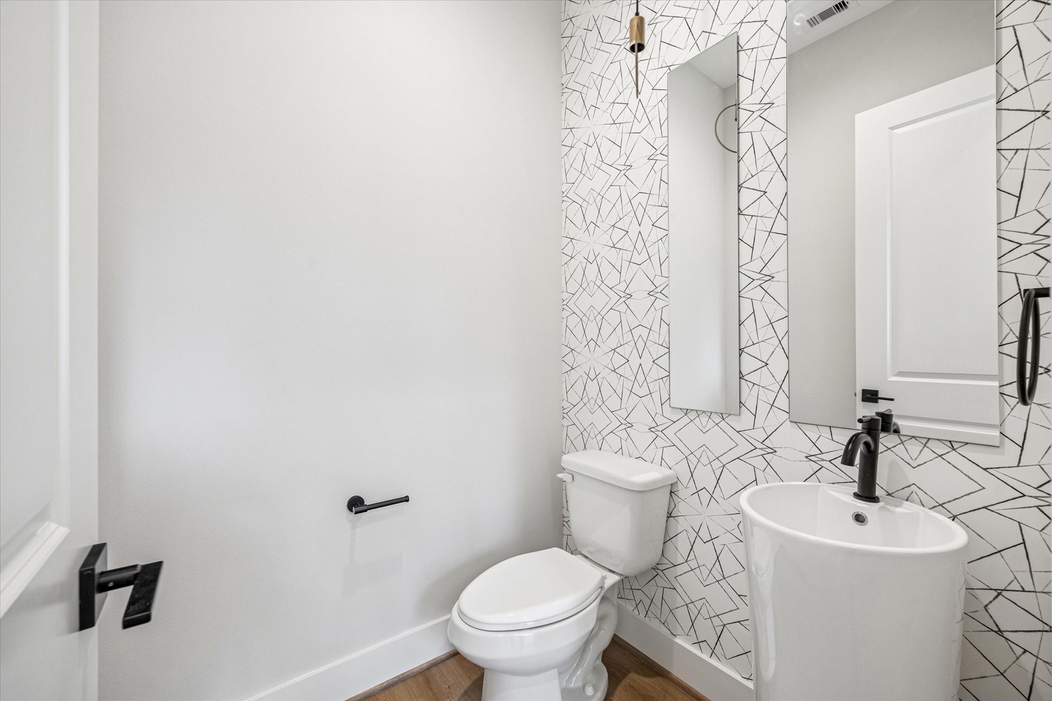 520 Janisch Road Houston, TX 77018 - Photo 23 of 28 a bathroom with a toilet sink and mirror