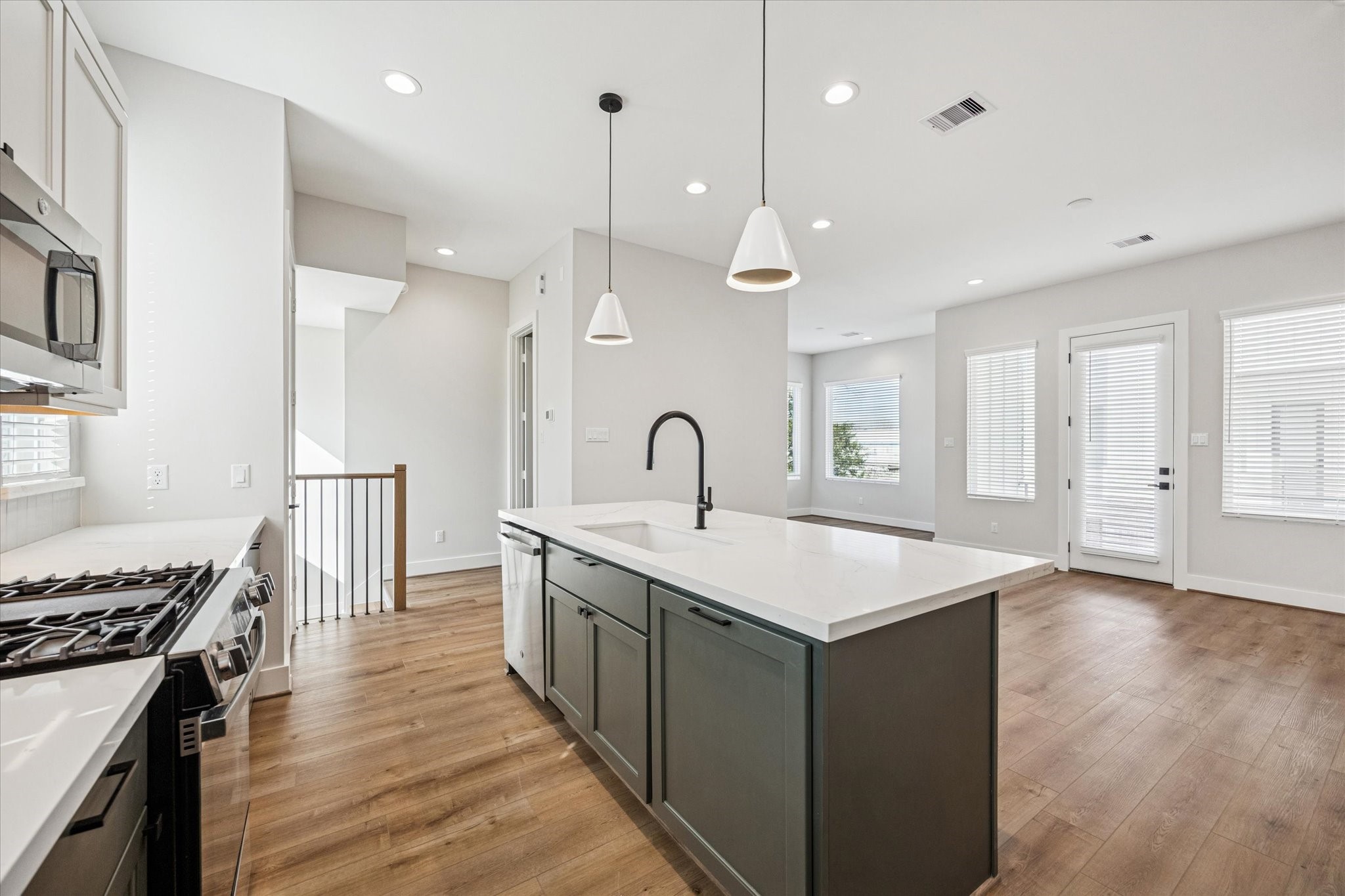 520 Janisch Road Houston, TX 77018 - Photo 6 of 28 a kitchen with counter top space a sink and appliances