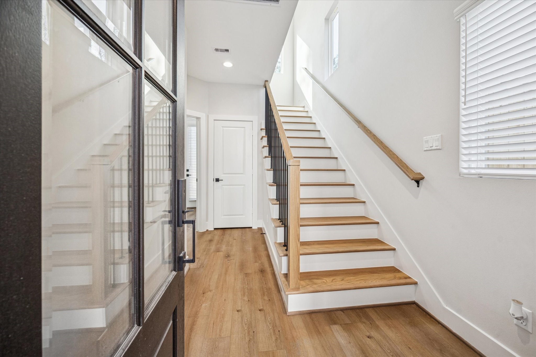 520 Janisch Road Houston, TX 77018 - Photo 7 of 28 a view of entryway and hall with wooden floor
