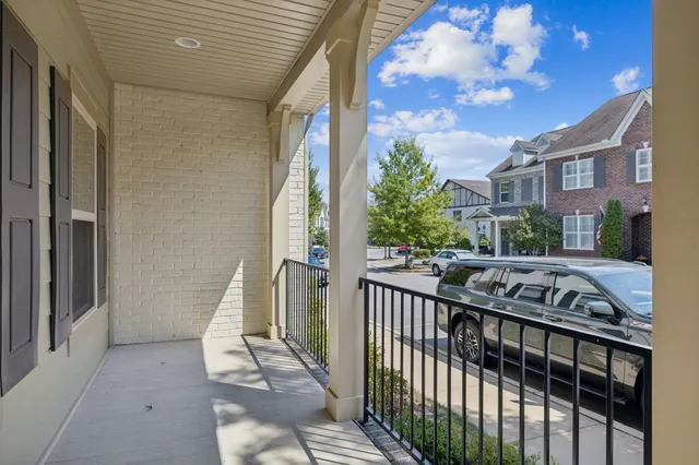 a view of a balcony with chairs