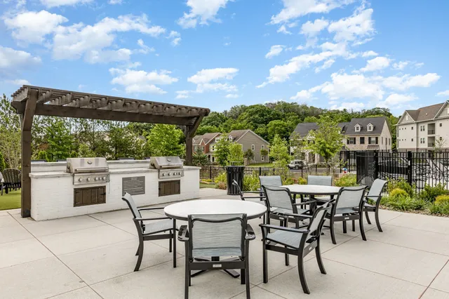 a view of a patio with a table and chairs