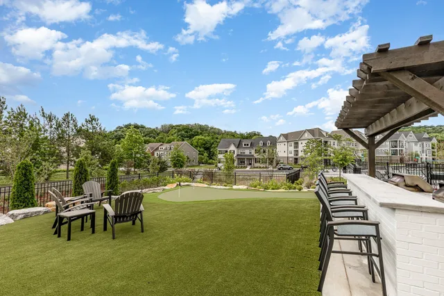 a view of a chairs and table in patio