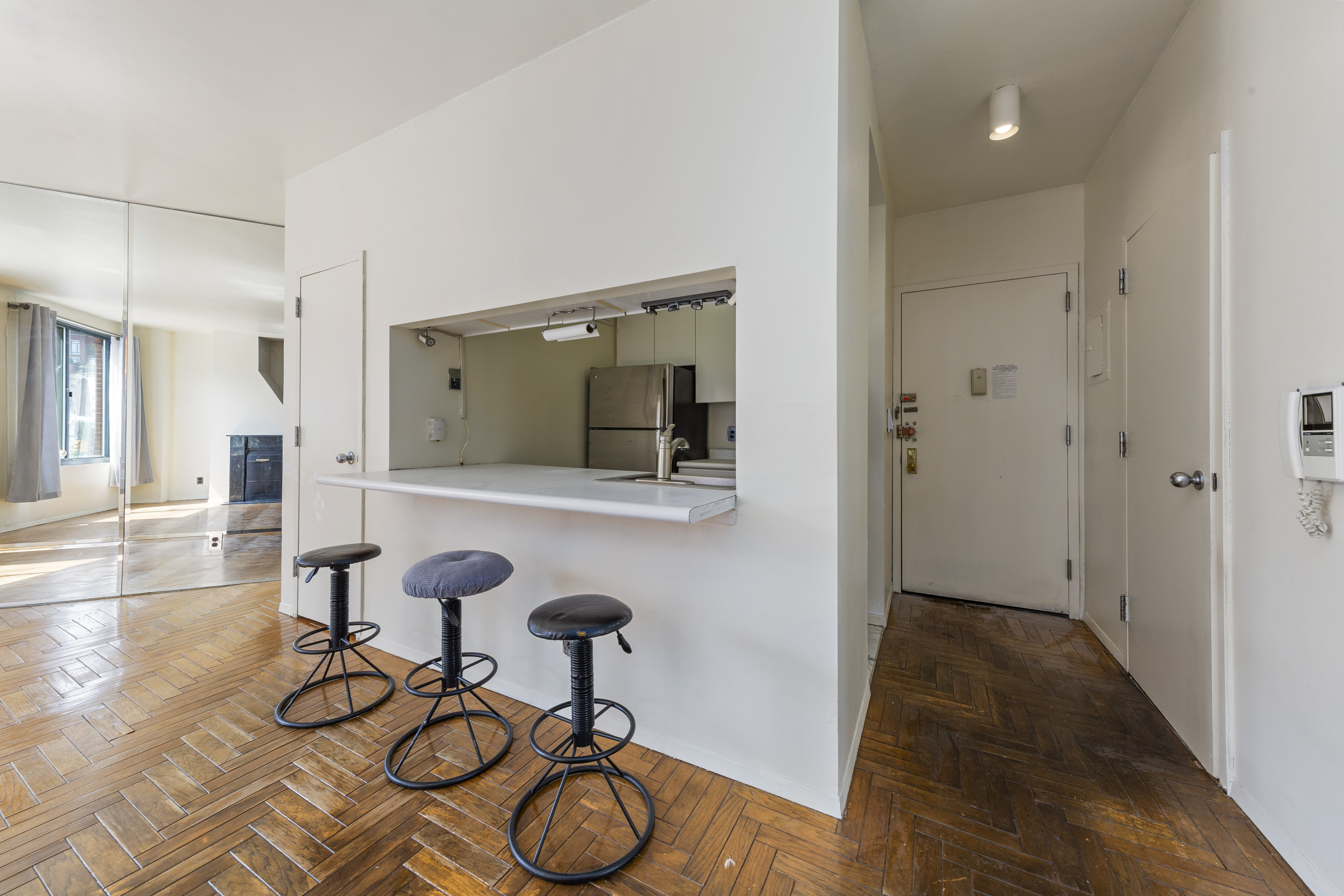 22 Perry Street, Unit 2B Manhattan, NY 10014 - Photo 3 of 9 a view of a livingroom with furniture and hardwood floor