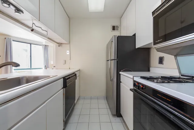 a kitchen with a stove and a refrigerator