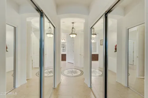 a view of a bathroom with a shower and mirror