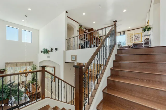 a view of entryway with wooden floor and stairs