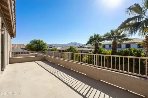 a view of balcony with furniture