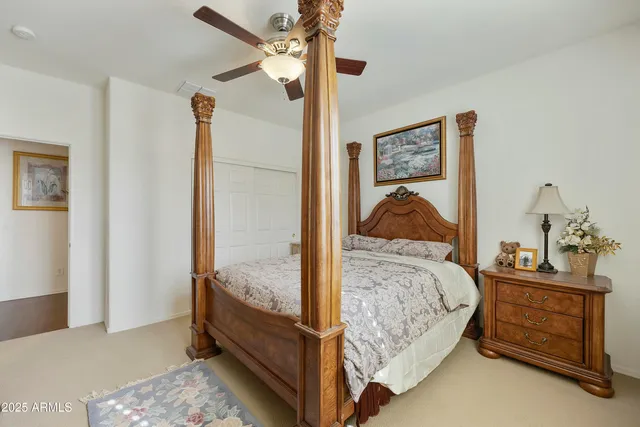 a bedroom with a bed and a dresser