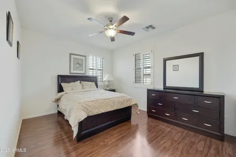 a bedroom with a bed and a dresser