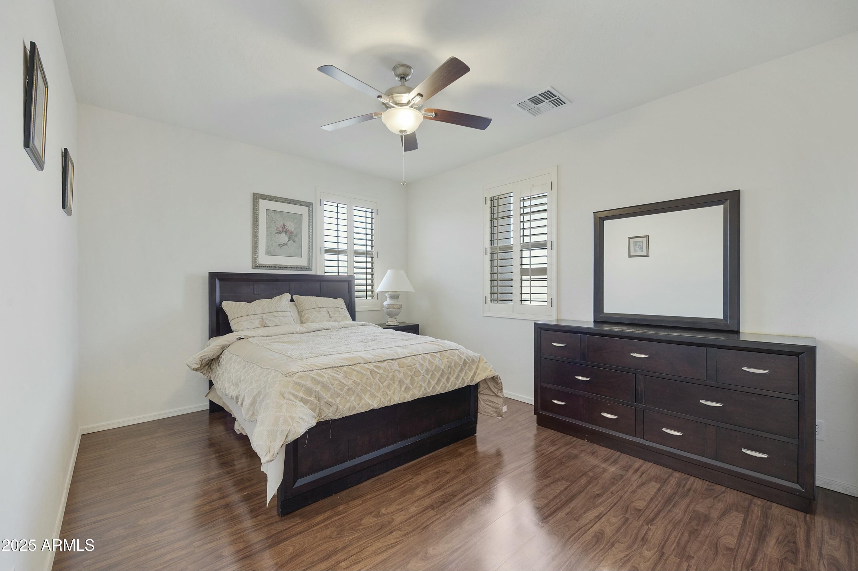 4615 West Corral Road Laveen, AZ 85339 - Photo 41 of 48 a bedroom with a bed and a dresser