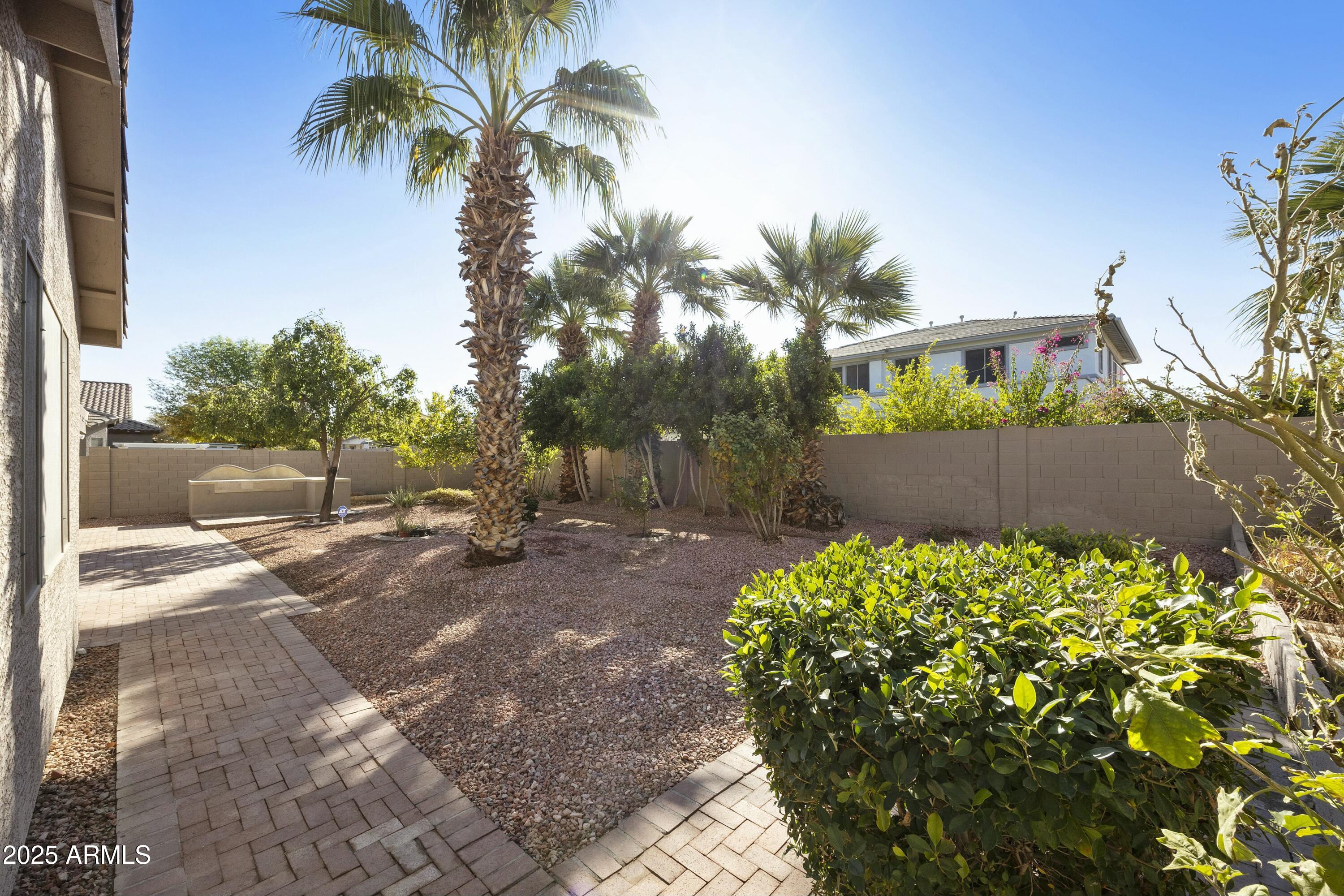 4615 West Corral Road Laveen, AZ 85339 - Photo 47 of 48 a view of a backyard with a garden