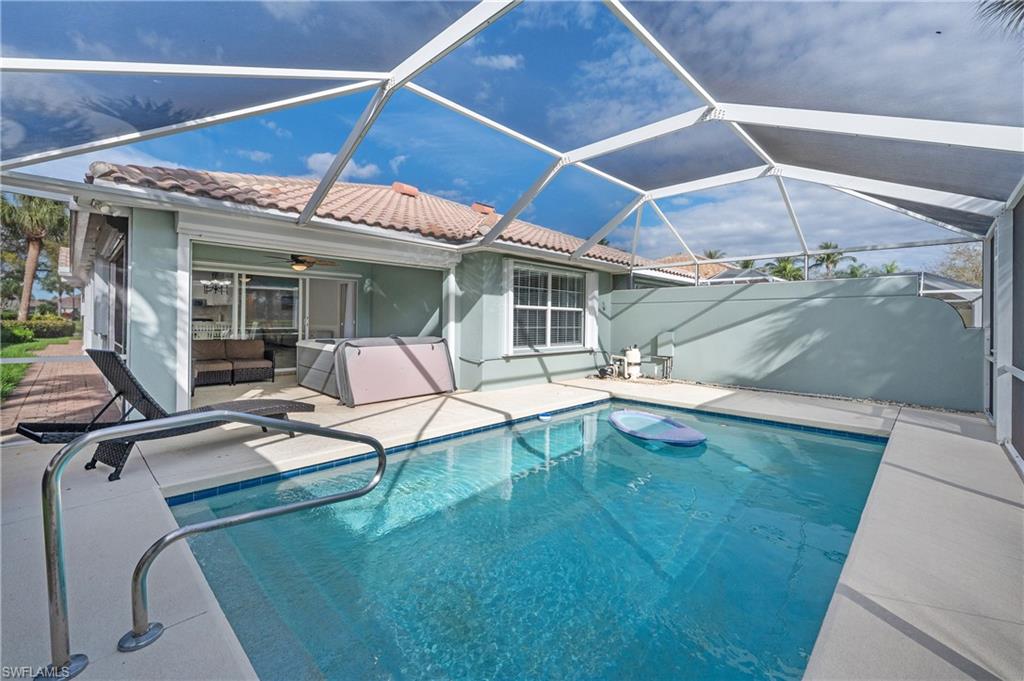 7221 Bellini Way Naples, FL 34114 - Photo 27 of 43 a swimming pool with outdoor seating yard and barbeque oven