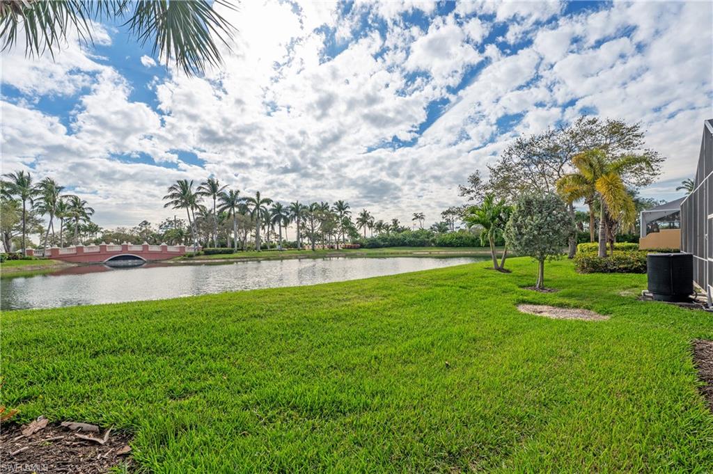 7221 Bellini Way Naples, FL 34114 - Photo 28 of 43 a view of a lake with a big yard