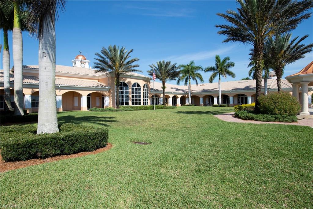 7221 Bellini Way Naples, FL 34114 - Photo 32 of 43 a front view of a house with a garden