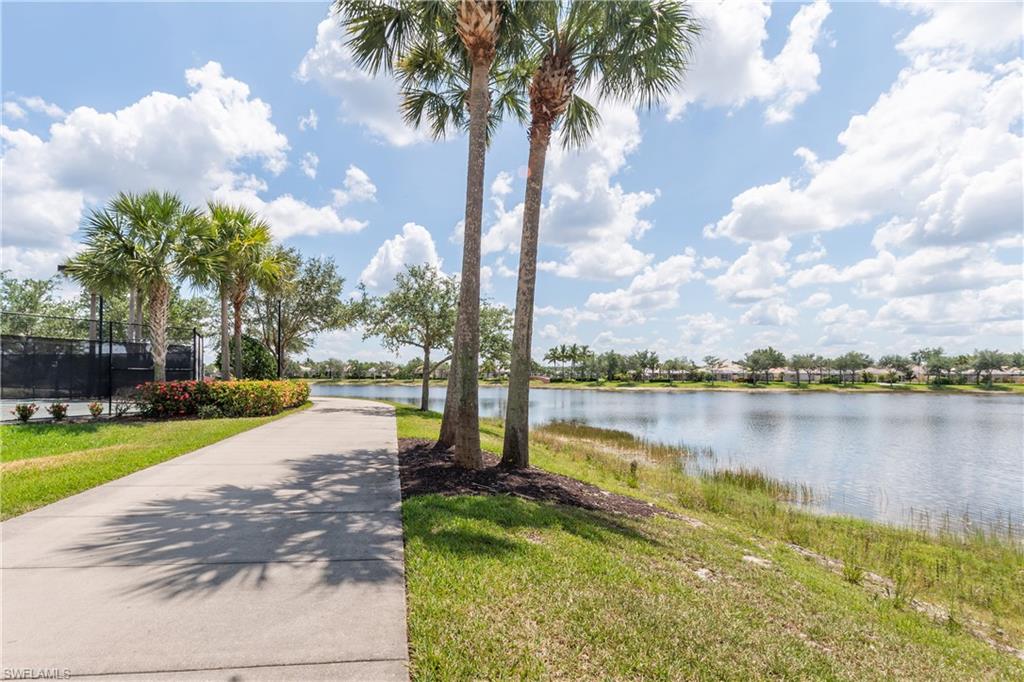 7221 Bellini Way Naples, FL 34114 - Photo 41 of 43 a view of a lake with houses in the background