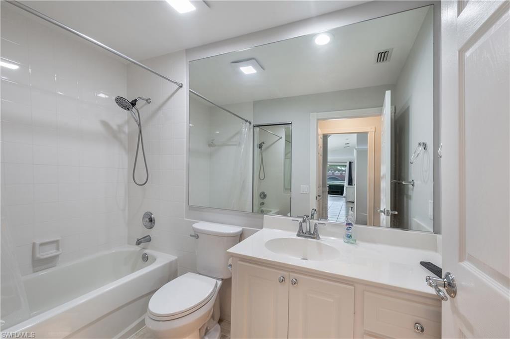 7221 Bellini Way Naples, FL 34114 - Photo 5 of 43 a bathroom with a sink a toilet and shower