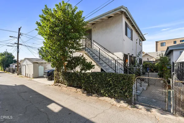a view of a house with a street