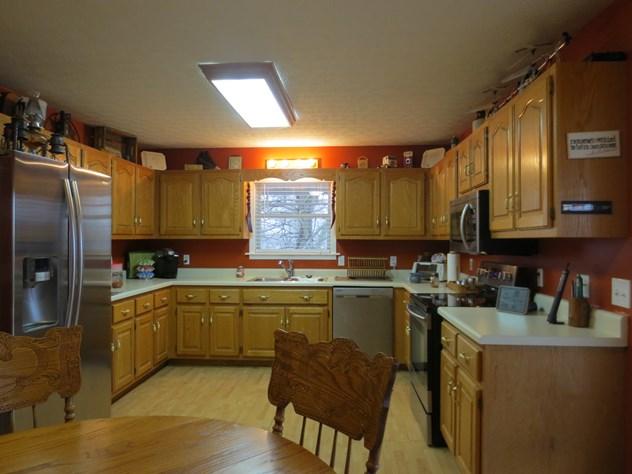 556 Womack Road Bethpage, TN 37022 - Photo 5 of 15 a kitchen with lots of counter top space and stainless steel appliances