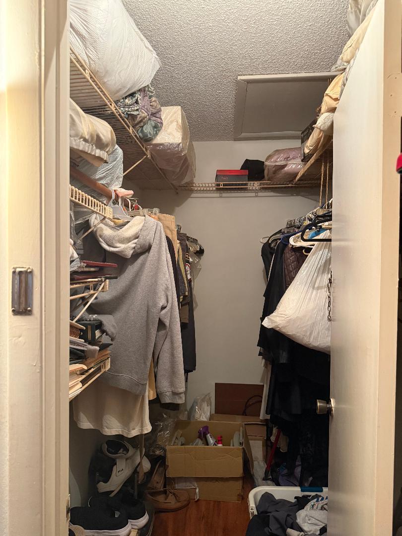 1985 Northeast 32nd Court, Unit 49 Lighthouse Point, FL 33064 - Photo 6 of 8 a view of walk in closet with clothes and shoes
