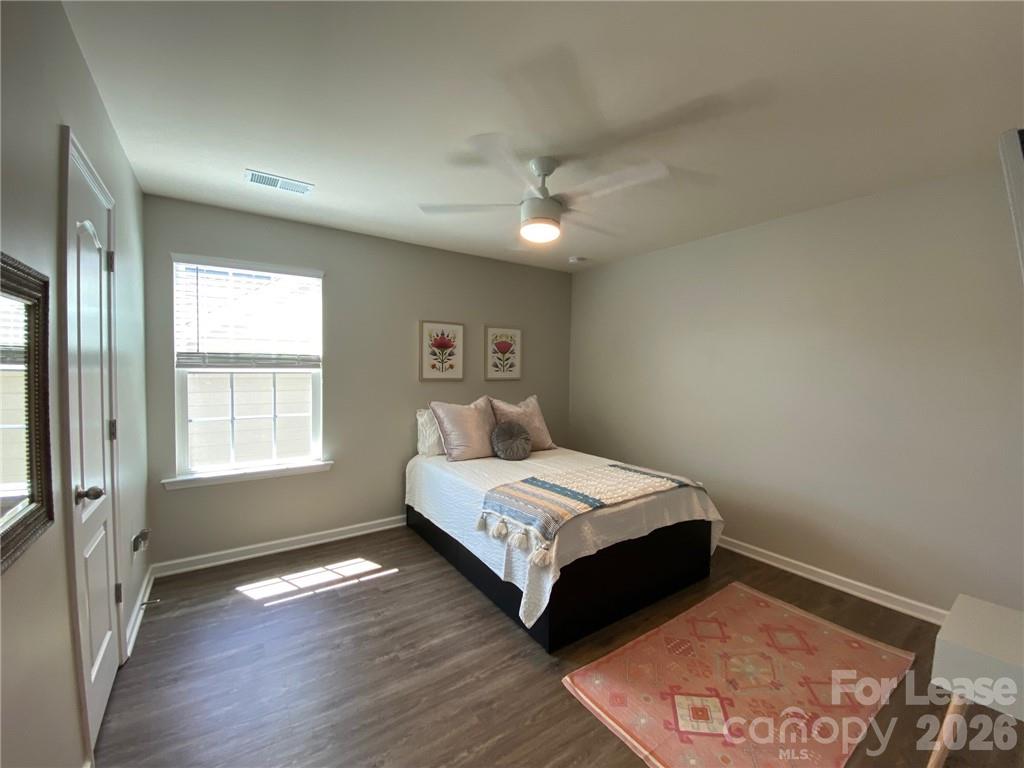 6434 Raffia Road Charlotte, NC 28277 - Photo 12 of 32 a bedroom with a bed and a window