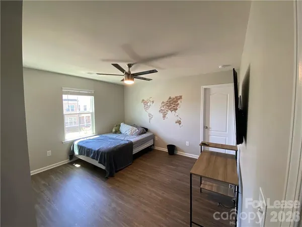 a bedroom with bed and window