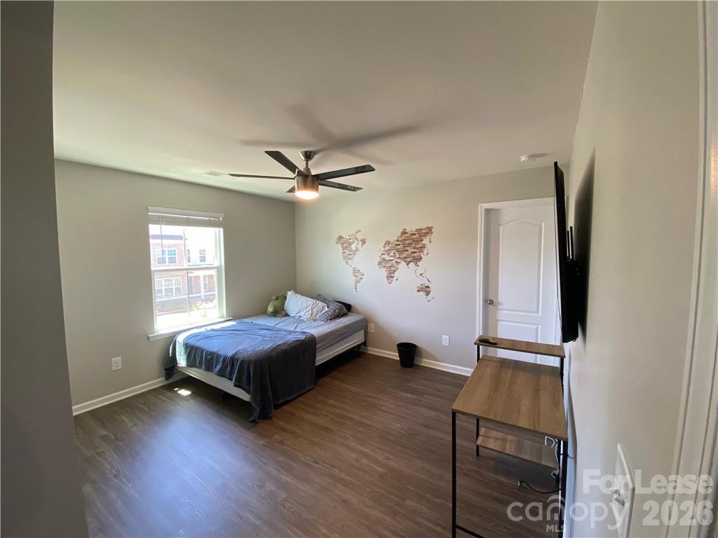 6434 Raffia Road Charlotte, NC 28277 - Photo 14 of 32 a living room with a bed furniture and a window
