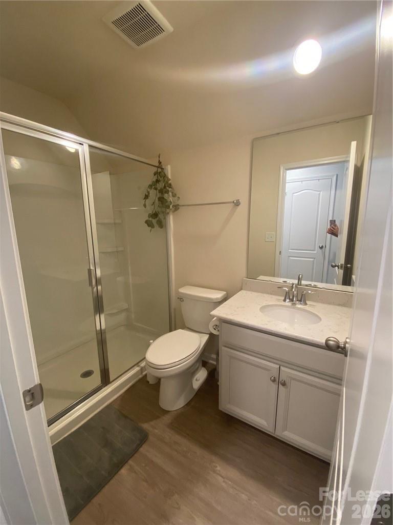 6434 Raffia Road Charlotte, NC 28277 - Photo 16 of 32 a bathroom with a sink a toilet and shower