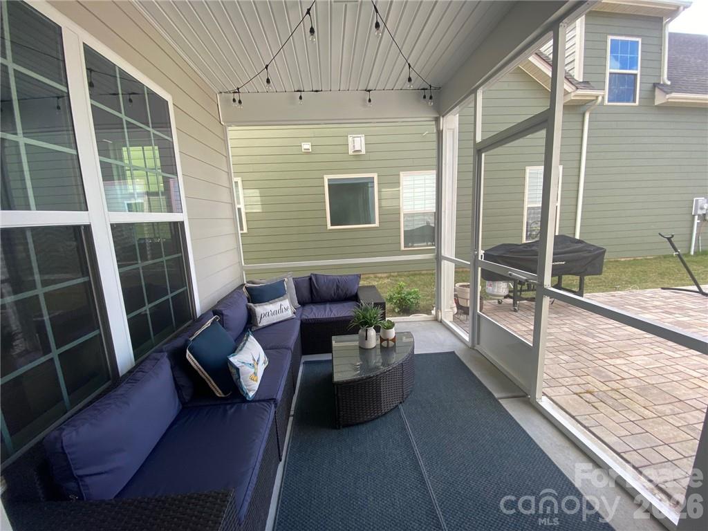 6434 Raffia Road Charlotte, NC 28277 - Photo 18 of 32 a balcony with furniture and wooden floor