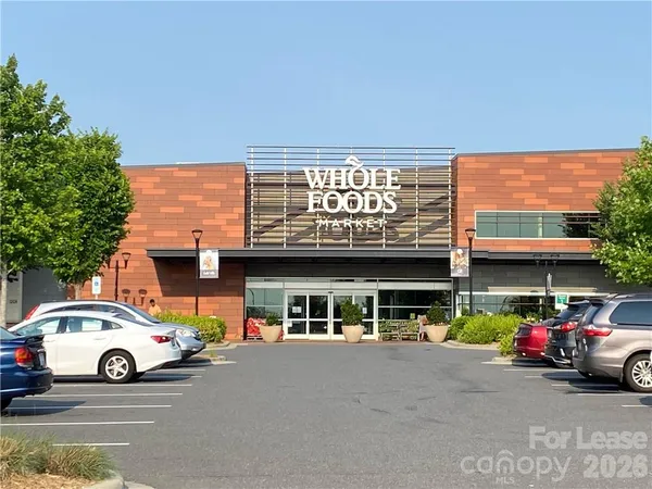 a view of a cars parked in front of a building
