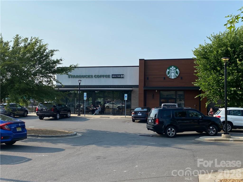 6434 Raffia Road Charlotte, NC 28277 - Photo 24 of 32 a view of a cars parked in front of a building