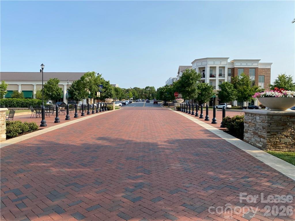 6434 Raffia Road Charlotte, NC 28277 - Photo 28 of 32 a view of a street with a building in the background